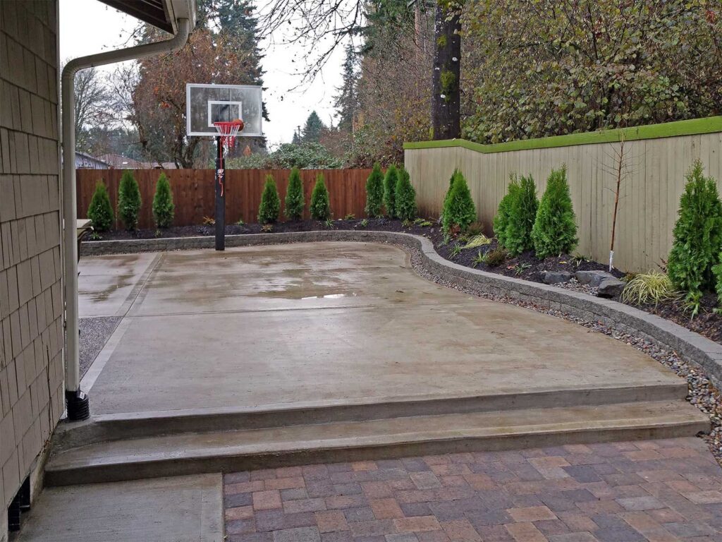 Concrete basketball court with an adjoining paver patio in Winchester VA