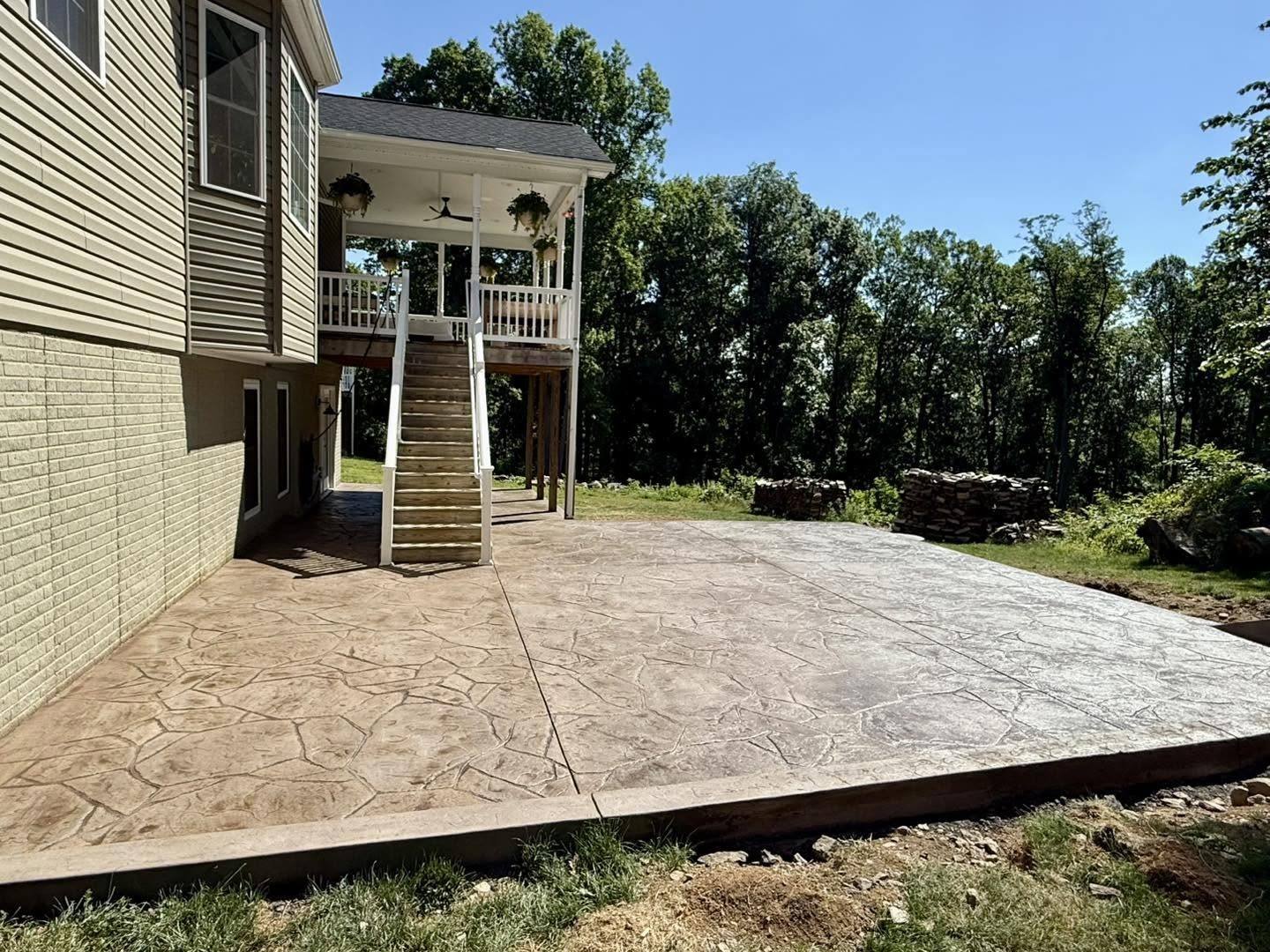 Wood plank stamped concrete walkway leading up to a home in Winchester VA