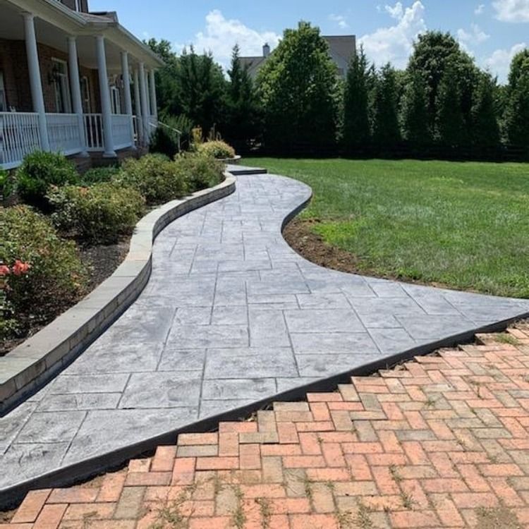 Stamped concrete walkway with a red brick border in Winchester VA