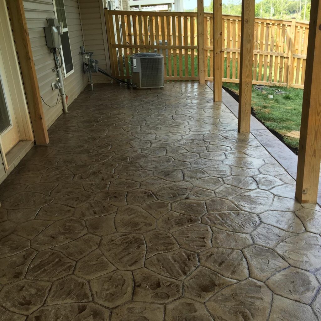 Brown stamped concrete floor on a covered back porch in Winchester VA