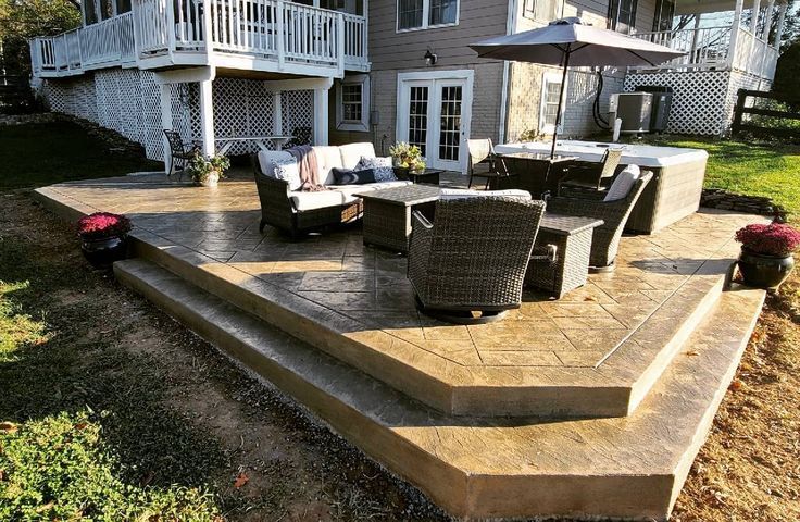 Large multi level stamped concrete patio with outdoor seating in Winchester VA