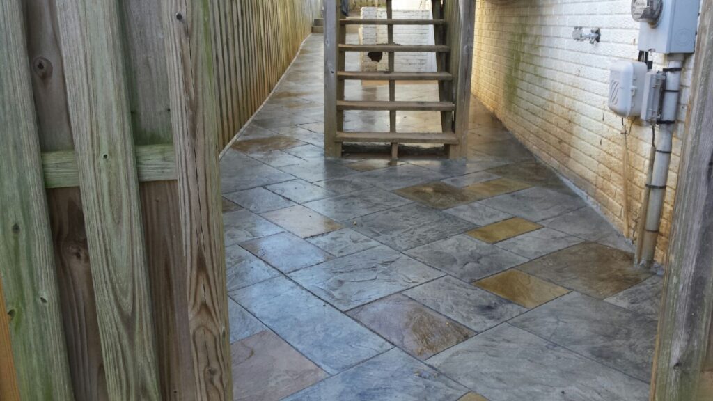 Concrete patio poured along the side of a home in Winchester VA