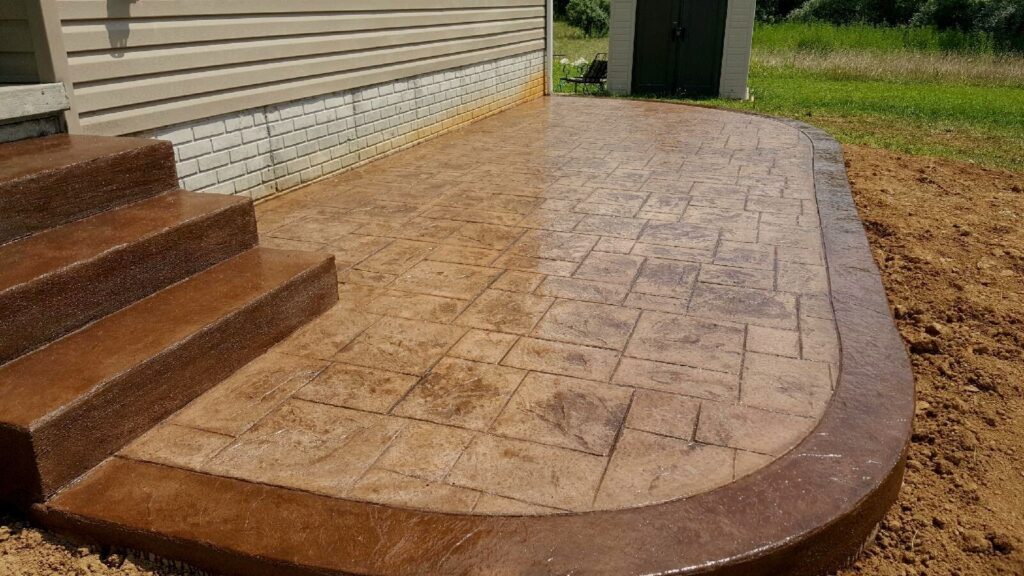 Tan stamped concrete patio with integral steps in Winchester VA