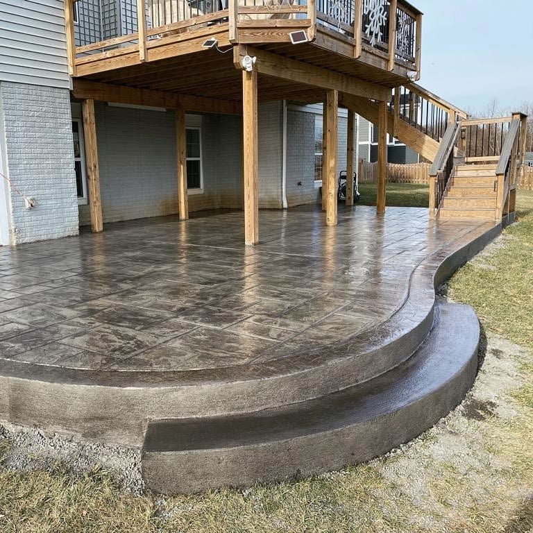 Under deck concrete patio with a contrasting border in Winchester VA